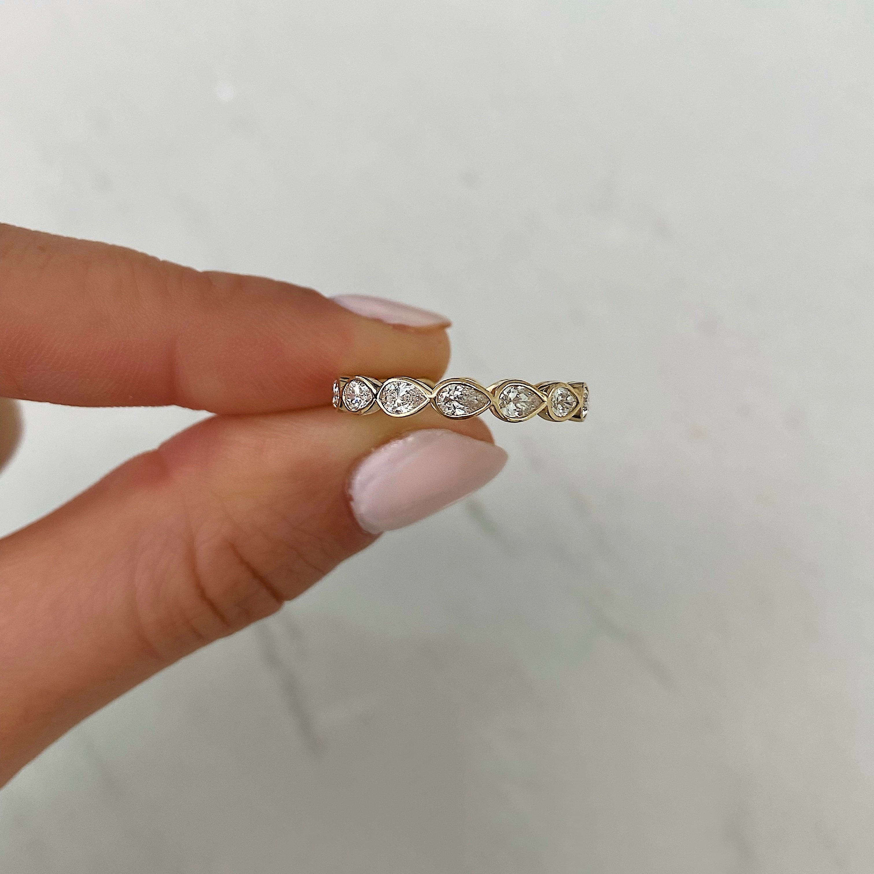 Sideways Pear Bezel Eternity Band